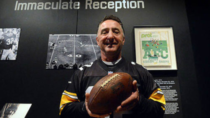 Jim Baker, who ended up with the ball from the Immaculate Reception, holds the prized possession Friday at the Heinz History Center.