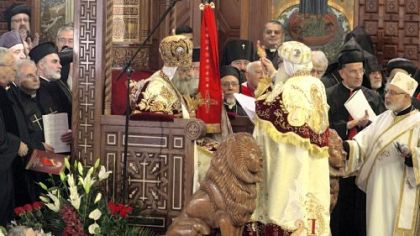 Pope Tawadros II, 60, sits Sunday on the throne of St. Mark, the Coptic church's founding saint, in the Coptic cathedral in Cairo during an elaborate ceremony lasting nearly four hours, attended by Egypt's Muslim prime minister and a host of Cabinet ministers and politicians.