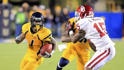 Tavon Austin set a I-A division record Saturday with 572 all-purpose yards, including a West Virginia record 344 rushing yards.