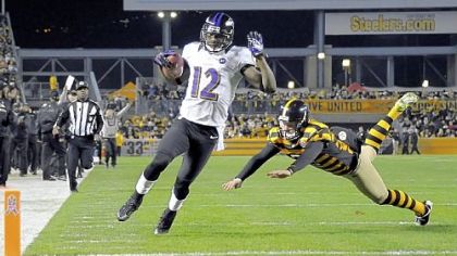The Ravens' Jacoby Jones runs into the end zone on a punt return in the first quarter Sunday at Heinz Field.