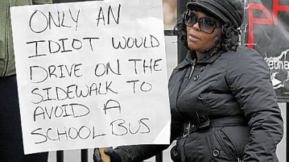 Shena Hardin of Cleveland in her court-ordered public shaming. (She's got company.)