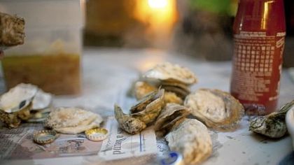 For the classic oyster roast you don't need a tablecloth.  Newspapers in the trunk of the car, destined to be recycled, work just fine.