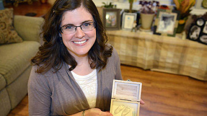 Heidi Solomon, 30, holds plaster casts of her son Jonah's feet at her home in Morgantown, W.Va. Jonah died when he was 2 days old after being born prematurely. Ms. Solomon continued to pump her breast milk after his death and donated the milk to other premature babies and their mothers.