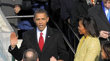 Michelle Obama holds Abraham Lincoln's Bible for her husband as he takes the oath of office of president, administered by Chief Justice John Roberts on Jan. 20, 2009.