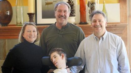 From left, Lisa Falcione, contractor Greg Allen, Frank Falcione, and their son, Andy Falcione.