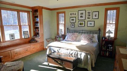 Master bedroom has a large window seat with drawers for storage. The windows are by Andersen.