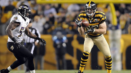 Heath Miller pulls in a pass as the Ravens' Jameel McClain defends in the second quarter at Heinz Field.