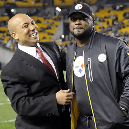Steelers head coach Mike Tomlin visits with former wide receiver Hines Ward before the game Sunday night against the Ravens at Heinz Field.