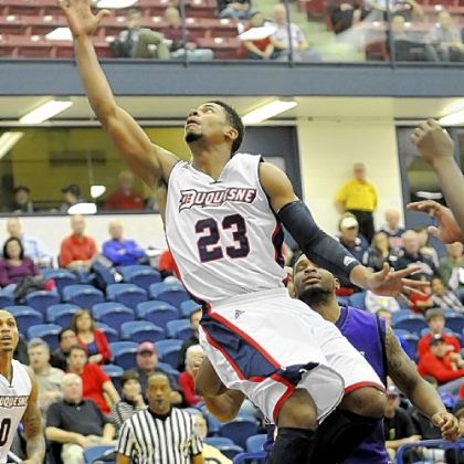 Duquesne's Jeremiah Jones drives to the basket against James Madison in the first half Monday night at A.J. Palumbo Center.