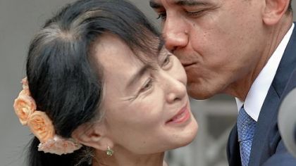 President Barack Obama kisses Myanmar opposition leader Aung San Suu Kyi after speaking to the media following their meeting at her residence in Yangon on Monday.