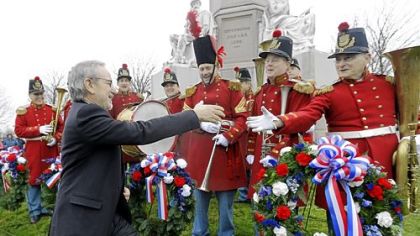 Director Steven Spielberg, left, greets members of The President's Own Band, a musical group of Civil War re-enactors, during Monday's ceremony in Gettysburg.