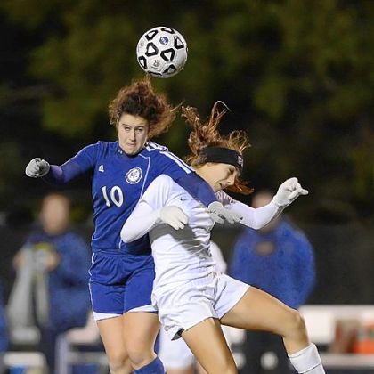 Shady Side's Zoe Schoen, left, heads the ball above Greensburg Central Catholic's Cassie Sauter in the PIAA semifinals.