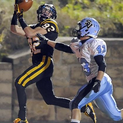 North Allegheny's Gregg Garrity pulls in a touchdown pass over Seneca Valley's Tyler Bommer last Friday night.