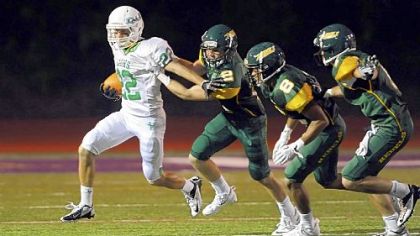 South Fayette's Grant Fetchet tries to get away from Seton-LaSalle defenders during a regular-season game.