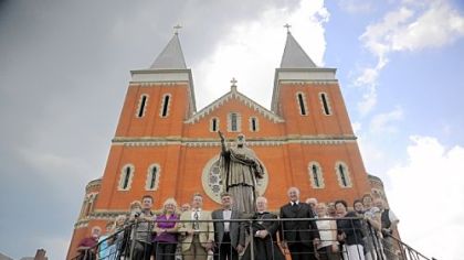 In this photo from 2009, a delegation from Thalmasing, Germany, Boniface Wimmer's hometown, poses for a portrait in front of St. Vincent Basilica.