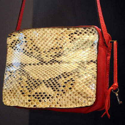 Python purse with red leather trim.