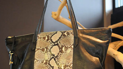 Python with black leather handbag.