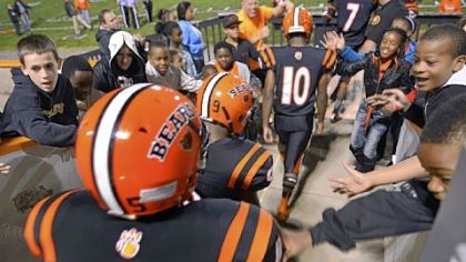 The Bears take the field to the cheers of adoring fans before their game against Imani Christian Academy.