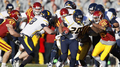 Iowa State defensive back Deon Broomfield (26) chases down West Virginia running back Shawne Alston (20) during the first half of an NCAA college football game Friday, in Ames, Iowa.