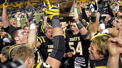 North Allegheny teammates celebrate their 21-14 win against Woodland Hills Friday in the WPIAL class AAAA championships at Heinz Field.