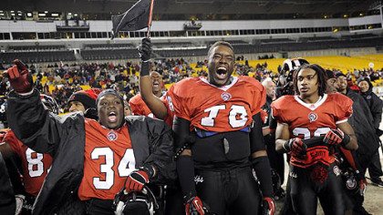 Aliquippa teammates celebrate during the final seconds of their 34-7 win against Washington Friday in the WPIAL class AA championships at Heinz Field.