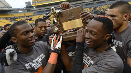 The Bears hold their WPIAL Championship trophy up after their 58-21 win against Sto-Rox Friday at Heinz Field.