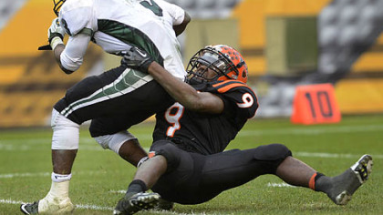 Clairton Bear Robert Boatright takes down Sto-Rox quarterback Lenny Williams Friday at Heinz Field.