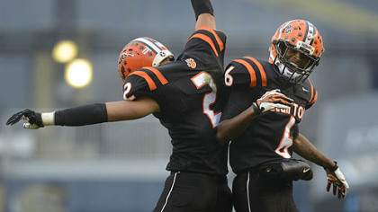 Clairton Bears Trenton Coles (left) and Titus Howard celebrate Coles touchdown Friday at Heinz Field. The Bears set a Pennsylvania record with its 60th consecutive victory, a 58-21 win against Sto-Rox in the WPIAL Class A title game.