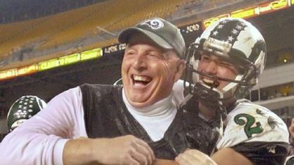 Pine-Richland coach Clair Altemus gets a hug from Neil Walker after defeating Thomas Jefferson for the 2003 Class AAA championship.