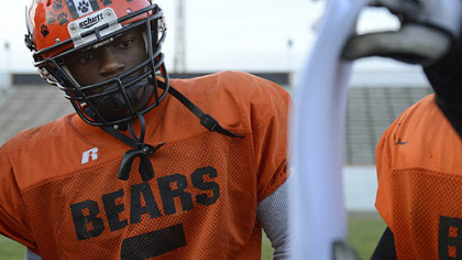 Senior wide receiver Terrish Webb, who has committed to Kent State, studies a route during a recent practice.