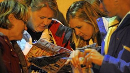 Sisters from left Terri Robinson, MaryBeth Sawhill, Tara Cowden and Brenda Sturgeon planned their course of action as they waited in line outside Toys R Us in Robinson before the 8 p.m. opening of the store on Thursday, November 22, 2012. The sisters, from McDonald, Pa., go Black Friday shopping every year.