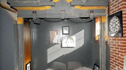 Items salvaged from an old church are part of the bedroom furnishings in the Fettermans' home.