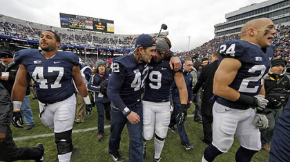 Penn State defensive lineman Jordan Hill (47), linebacker Michael Mauti (42), running back Michael Zordich (9) and running back Derek Day (24) walk off the field after a senior recognition ceremony.