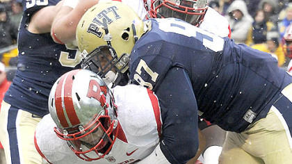 Pitt's Aaron Donald sacks Rutgers quarterback Gary Nova in the second quarter this afternoon at Heinz Field.