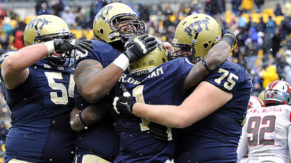 Pitt's Ray Graham is congratulated after a touchdown against Rutgers in the second quarter this afternoon at Heinz Field.