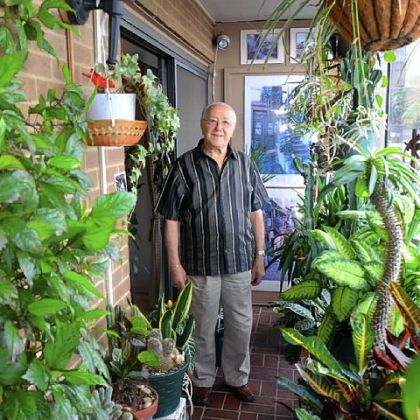 Saul Kaufman loves his balcony jam packed with plants at Dithridge House in North Oakland.