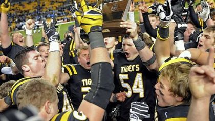 North Allegheny players celebrate their win Friday against Woodland Hills in the WPIAL Class AAAA championship at Heinz Field.