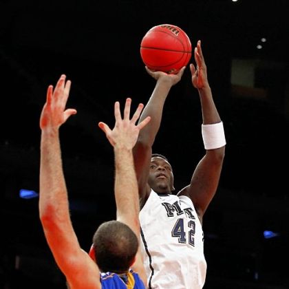 Pitt forward Talib Zanna shoots over Delaware's Carl Baptiste Friday at Madison Square Garden in New York.