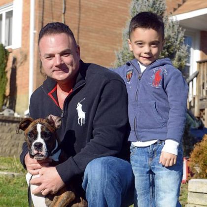 Joey Deiuliis with his son Gavin, 6, and Bowser, their 6-month-old boxer.