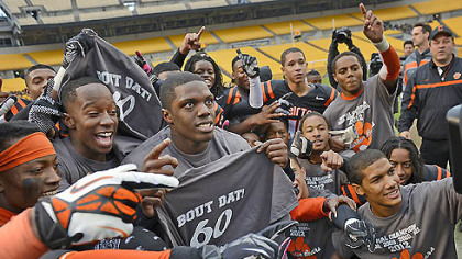 The Clairton Bears celebrate their state-record-breaking 60th consecutive victory after defeating Sto-Rox, 58-21, to take home the WPIAL Class A championship Friday at Heinz Field.