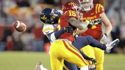 West Virginia safety Darwin Cook, left, breaks up a pass indented for Iowa State wide receiver Chris Young Friday in Ames, Iowa. West Virginia won, 31-24.
