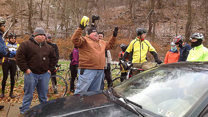 Ron Lutz, a team's organizers, gives cautionary instructions to his group before the
start of the Dirty Dozen Race today, warning one of the hills may be "impassable" because of the early morning snow that dusted the Pittsburgh region's higher elevations.