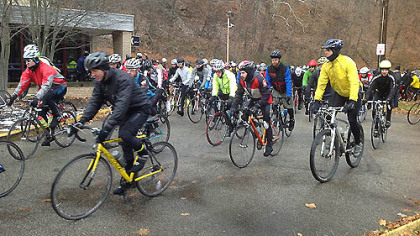 Mackenzie Carpenter Nov. 24, 2012
At: along Washington Boulevard at the start of the Dirty Dozen Race.
Caption: And they''re off ...
Background: here are pics of the start of
the Dirty Dozen race.  Cyclists head off the mark today in the 19th annual Dirty Dozen Race featuring Pittsburgh's steepest
streets, including Canton Avenue, thought to be the steepest street in the United
States.