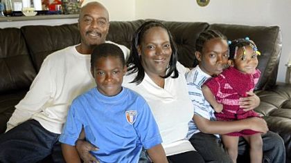 William and Dionne Moore with their children William, 14, right, Dion, 8 and Jadynn, 2.