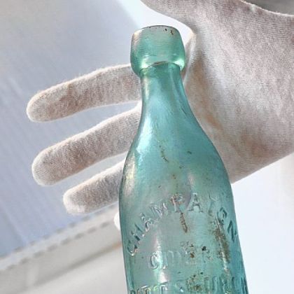 A Champaign Cider bottle excavated at the site dates to the mid-1860s.