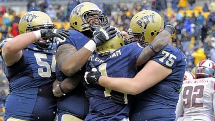 Pitt's Ray Graham, center, is congratulated after a touchdown against Rutgers in the second quarter Saturday at Heinz Field.