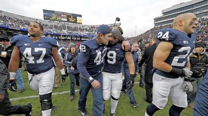 Penn State linebacker Michael Mauti (42) embraces running back Michael Zordich (9) as they walk off the field after a senior recognition ceremony before Saturday's game against Wisconsin in University Park, Pa.