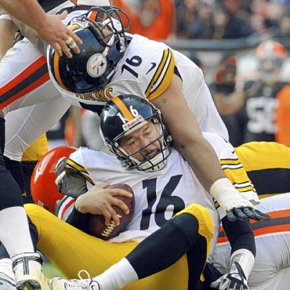 Steelers lineman Mike Adams lands on top of quarterback Charlie Batch after Batch was sacked against the Browns Sunday in Cleveland.