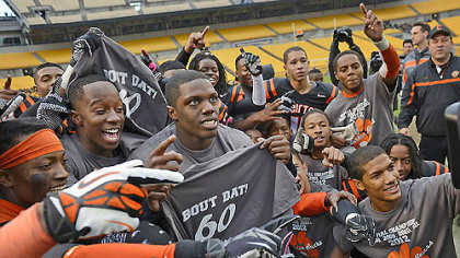 The Clairton Bears celebrate their state-record-breaking 60th consecutive victory after defeating Sto-Rox, 58-21, to take home the WPIAL Class A championship Friday at Heinz Field.