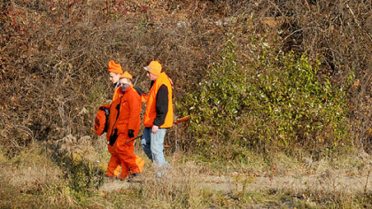 Braydon Haun, Cory Tetzlaw and Mike Schmitt, all of Brighton Heights, walk out of the State Game Lands along Route 22 near Florence and Star Lake in Washington back toward their car for a break late this morning. Mr. Schmitt said they will hunt for deer till dark.